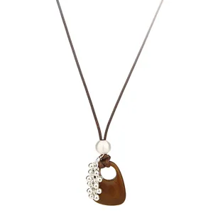 Wooden hollow water drop pendant necklace with leather cord and silver beads for women.