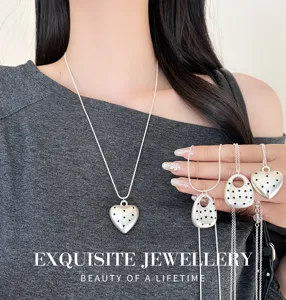 Silver polka dot heart necklace and bag pendant detail view, Korean ins style chic jewelry.