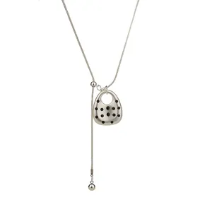 Silver long sweater chain necklace featuring a stylish dotted pendant main view display