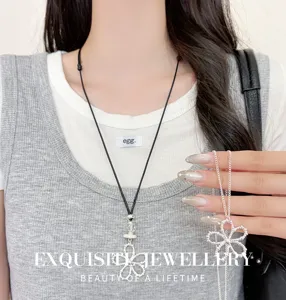 Detailed close-up of Korean style silver hollow flower black cord pendant fashion necklace.