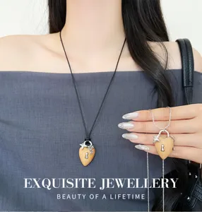 Wooden heart padlock pendant necklace close-up, black cord and silver chain style detail.