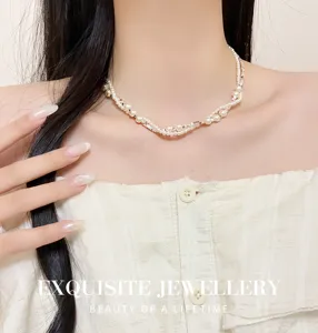 Detailed shot of double layered twist pearl clavicle chain, elegant lightweight luxury design.
