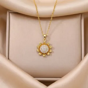Close-up detail of the elegant sunflower pendant necklace with sparkling zircon and satin box.
