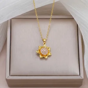 Detail shot of the exquisite sunflower pendant necklace featuring sparkling pink zircon stones.
