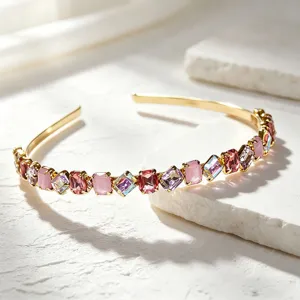 Exquisite rhinestone gold headband, sparkling crystal details, elegant hair accessory for women.