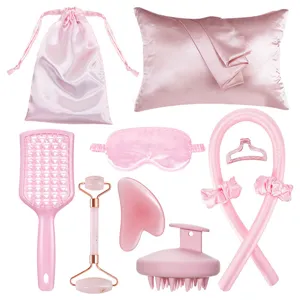 Detailed view of the pink heatless hair curler and beauty accessory set