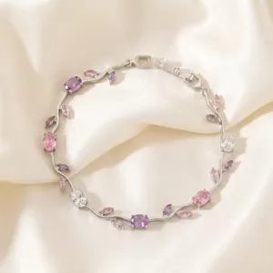 Silver branch zircon bracelet detail showing sparkling pink and purple crystal stones setting.