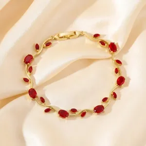 Elegant gold-plated branch bracelet with sparkling red zirconia stones for daily wear now.