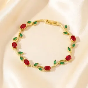 Exquisite gold-plated twig bracelet featuring vibrant red and green zircon stones, perfect detailed shot.