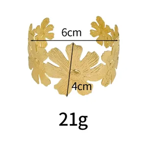 Gold metal open cuff bracelet with exaggerated daisy flower hollow design for fashion women.