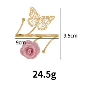 Gold metal arm cuff and curtain buckle featuring a hollow butterfly and pink velvet rose detail.