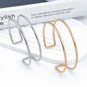 Bracciale da braccio aperto doppio in metallo regolabile set in colori argento e oro.