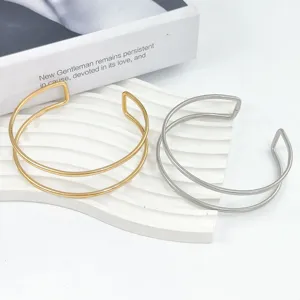 Bracciale rigido aperto in metallo minimalista, fascia da braccio geometrica