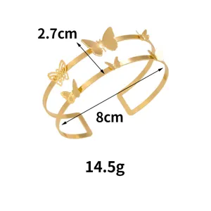 Bracciale aperto a doppio strato dorato con farfalle 3D traforate, gioiello elegante.