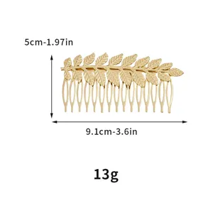 Gold leaf hair comb detail view, metal bridal hair accessory and side clip for elegant hairstyles.