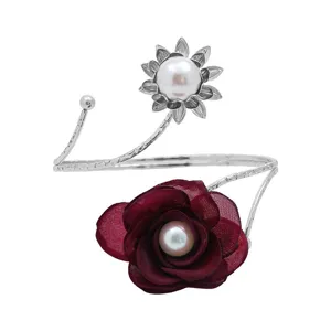 Detailed view of the elegant open metal curtain tieback featuring a pearl and fabric rose.