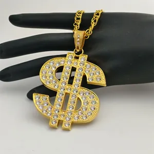 Gold dollar sign pendant necklace hip hop rhinestone bling jewelry detail view shiny finish