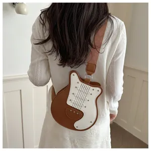 Creative guitar shaped crossbody bag for women, stylish patchwork shoulder bag with rivets.
