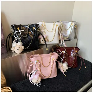 Stylish quilted bucket shoulder bag with gold chain and cute bear charm for women daily wear
