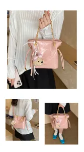 Pink quilted bucket shoulder bag with chain strap and cute bear charm for women style.