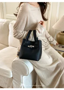 Black litchi grain leather bucket bag with metal lock detail, chic daily handbag for women.