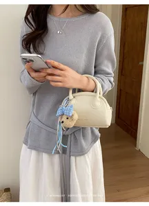 Korean minimalist retro boston bag for women, chic small handbag with cute bear pendant.