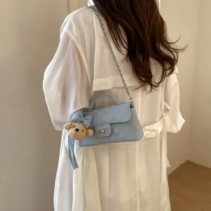 Chic quilted shoulder bag for women, elegant chain strap crossbody purse with cute bear charm.