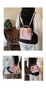 Detailed back view of pink plaid tweed convertible backpack, showing multi-way wear style.