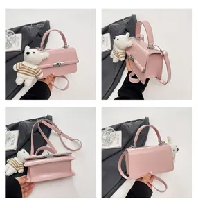Pink patent leather crossbody bag with cute plush bear pendant, chic small handbag for women.