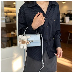 Women stylish retro small square handbag crossbody bag with cute bear pendant for daily wear.