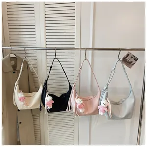 Chic multi-color hobo dumpling shoulder bag, trendy casual crossbody bag featuring cute bear pendant.