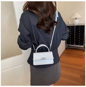 Chic light blue patent leather crossbody bag with top handle, stylish square design for women.