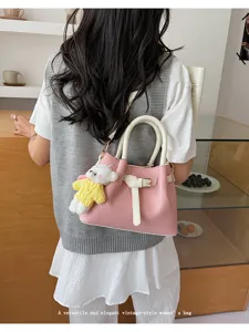 Korean style pink leather handbag with white handles and cute bear pendant for daily use