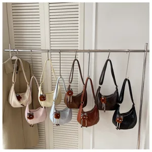 Stylish women shoulder bag large capacity casual crossbody bag with cute pendant for daily commute.