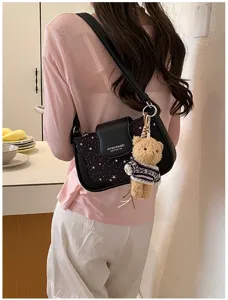 Fashion casual star print leather underarm shoulder bag with cute teddy bear plush charm.
