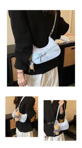 Elegant light blue hobo shoulder bag with cute star prints, bow strap and plush bear pendant.