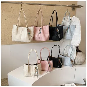 Minimalist canvas shoulder tote bag, large capacity casual handbag with chic charm.