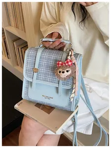 Korean style color block tweed backpack and shoulder bag with cute plush keychain for women detail.