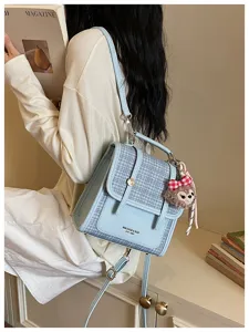 Korean style spliced tweed crossbody backpack detail showing chic design and plush pendant.