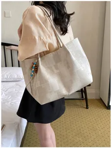 Casual minimalist shoulder tote bag with beaded charm detail, ideal for daily wear.
