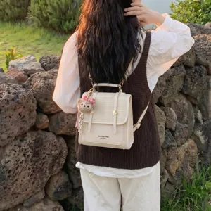 Korean style contrast color backpack for women, chic retro PU leather school shoulder bag.