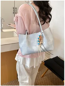 Detail of Korean casual tote bag with bead pendant, stylish and spacious for daily use.