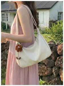 Simple large capacity women shoulder bag casual hobo bag with cute plush pendant.