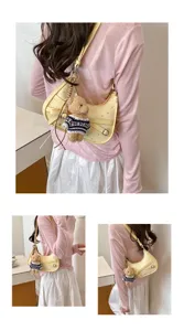 Vintage yellow crescent shoulder bag for women featuring cute plush bear pendant daily use