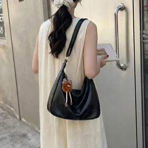Minimalist large capacity women's shoulder bag, stylish casual hobo bag with cute plush pendant.