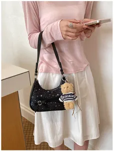 Retro black shoulder bag with star print, stylish bowknot and cute teddy bear charm for women.