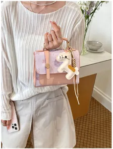 Stylish small handbag with cute horse charm detail, elegant fashion crossbody bag for women.