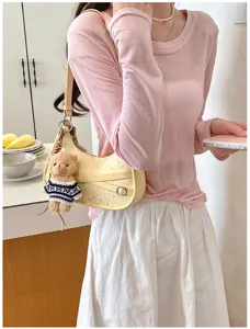 Chic yellow shoulder bag with star pattern and cute bear charm for daily commuting.