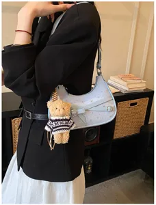 Chic light blue shoulder bag with star pattern and cute bear pendant for daily commuting.