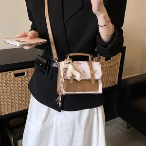 Stylish women's crossbody handbag, trendy fashion top-handle square bag with cute charm design.